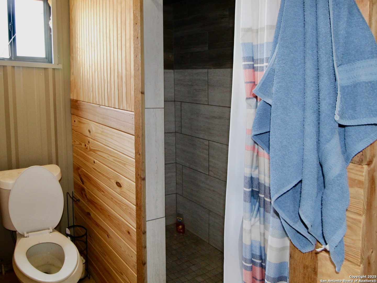 12365 Rudolph Road, Unit 3 Atascosa, TX 78002 - Photo 41 of 42 a bathroom with a toilet and a shower