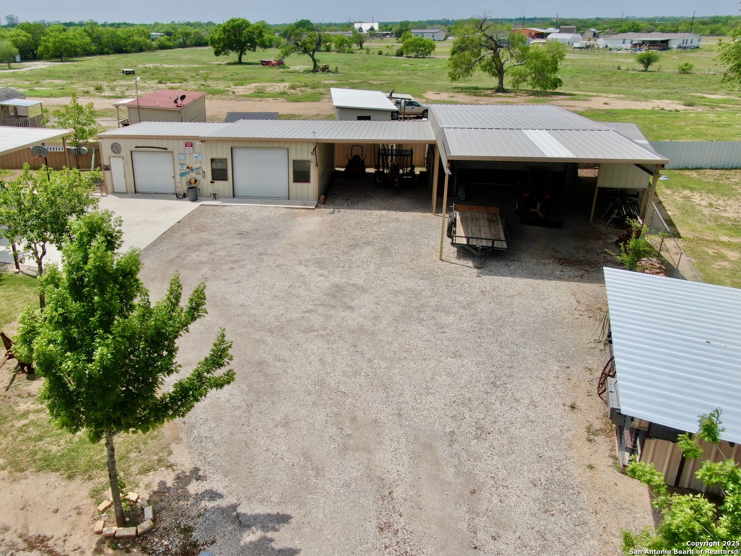 12365 Rudolph Road, Unit 3 Atascosa, TX 78002 - Photo 42 of 42 an aerial view of a house with a yard basket ball court and outdoor seating