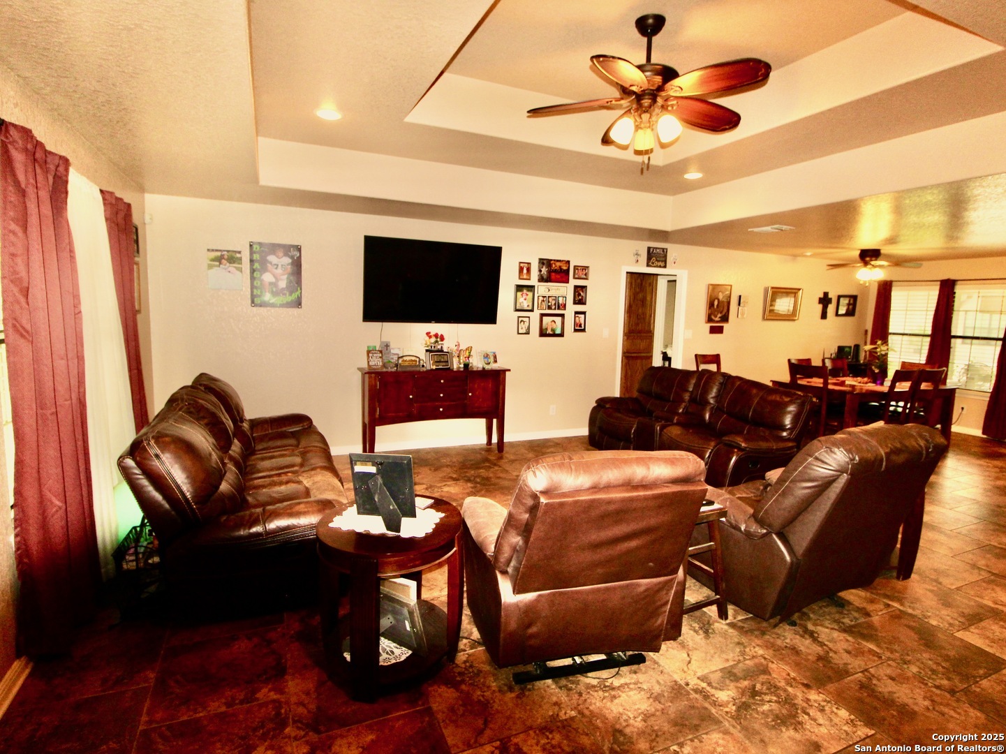 12365 Rudolph Road, Unit 3 Atascosa, TX 78002 - Photo 5 of 42 a living room with furniture a flat screen tv and kitchen view