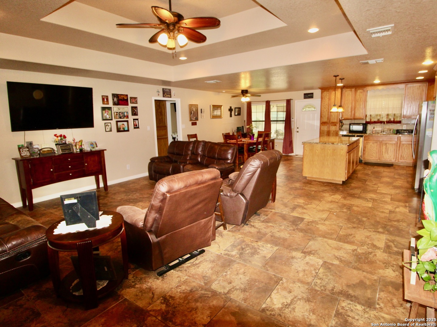 12365 Rudolph Road, Unit 3 Atascosa, TX 78002 - Photo 6 of 42 a living room with furniture and a flat screen tv