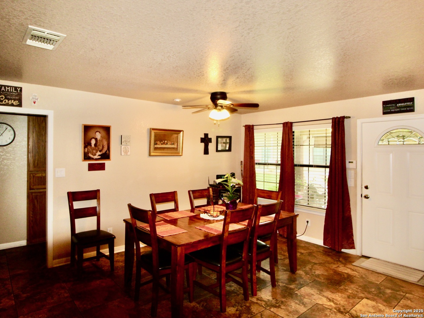 12365 Rudolph Road, Unit 3 Atascosa, TX 78002 - Photo 9 of 42 a view of a dining room with furniture and wooden floor