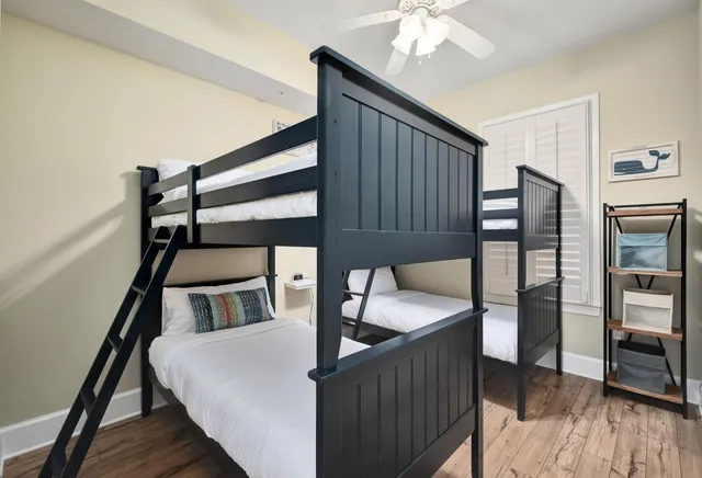 a balcony view with two chairs and wooden floor