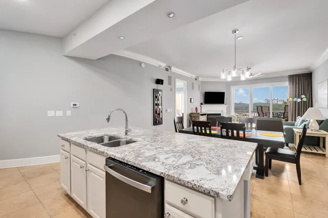 a kitchen with stainless steel appliances granite countertop a stove and a sink
