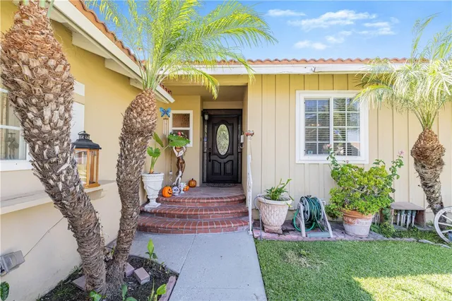 a view of a house with a fountain back yard