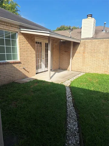a house view with a garden space