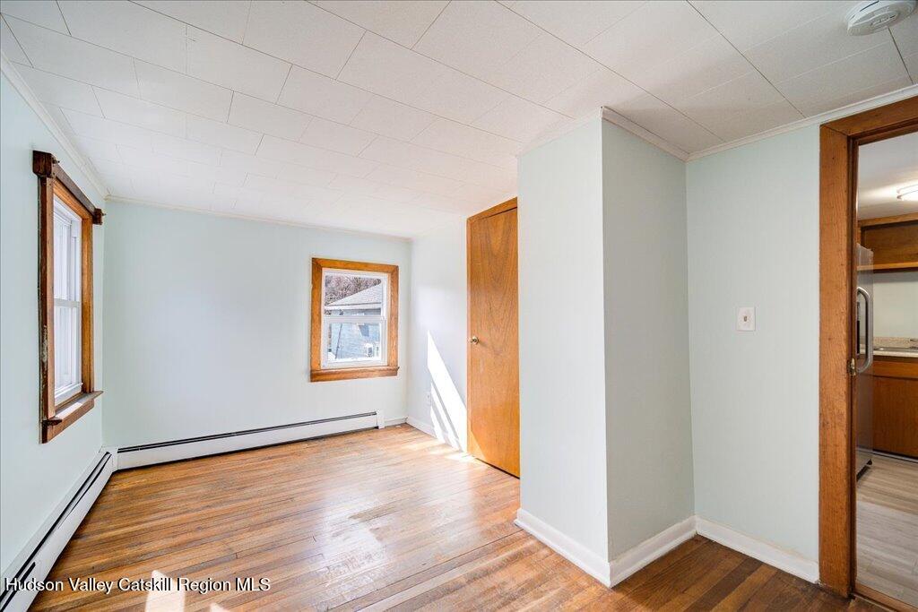 385 Main Street Rosendale, NY 12472 - Photo 15 of 23 a view of an empty room with wooden floor and a window