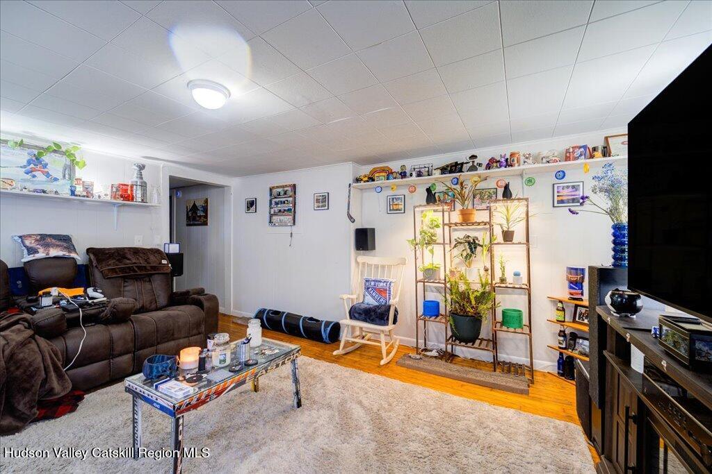 385 Main Street Rosendale, NY 12472 - Photo 18 of 23 a living room with furniture a flat screen tv and a window