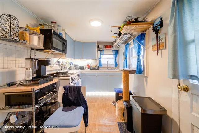 a kitchen with stainless steel appliances granite countertop a stove and a sink