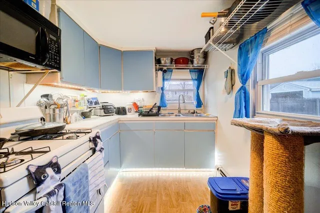 a kitchen with stainless steel appliances granite countertop a stove and a sink