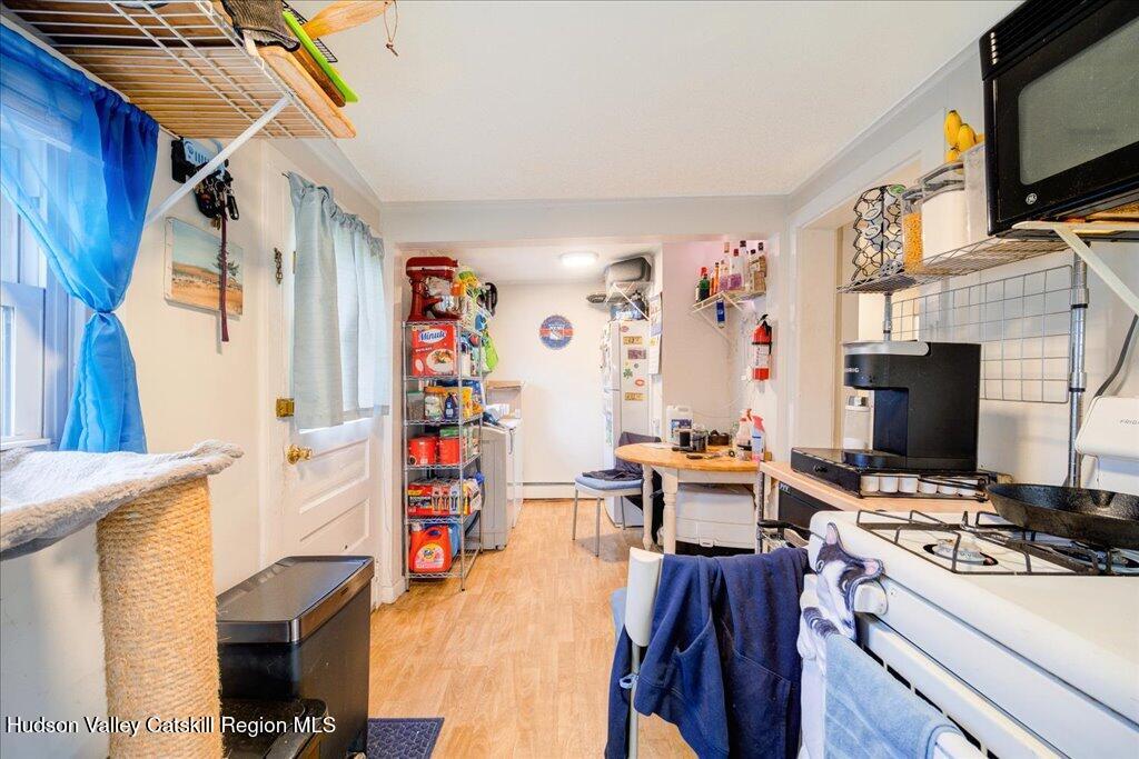 385 Main Street Rosendale, NY 12472 - Photo 22 of 23 a view of a workspace with furniture and flat screen tv