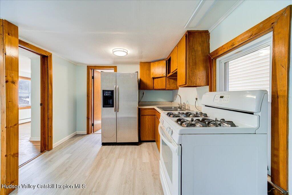 385 Main Street Rosendale, NY 12472 - Photo 4 of 23 a kitchen with stainless steel appliances granite countertop a sink stove and refrigerator
