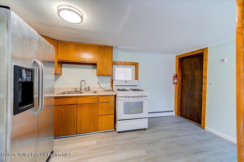 385 Main Street Rosendale, NY 12472 - Photo 6 of 23 a kitchen with stainless steel appliances granite countertop a stove and a refrigerator