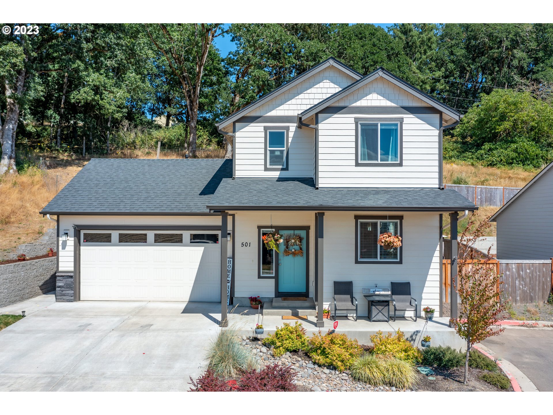 501 Merlot Street Amity, OR 97101 - Photo 1 of 44 a view of a house with wooden fence next to a yard
