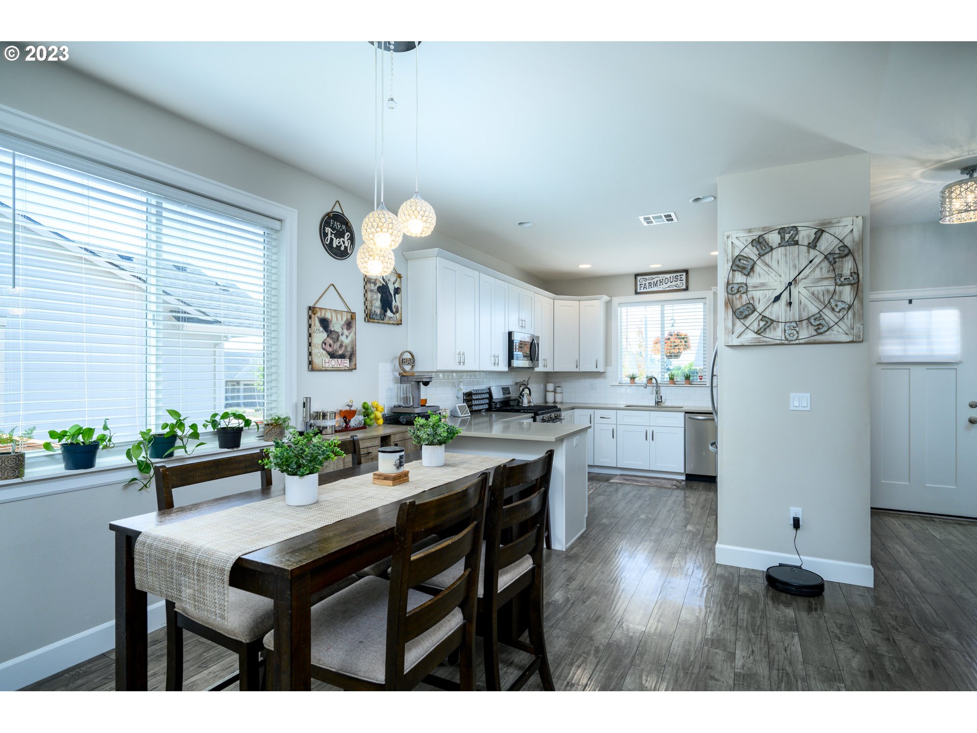 501 Merlot Street Amity, OR 97101 - Photo 11 of 44 a kitchen with a table and chairs in it