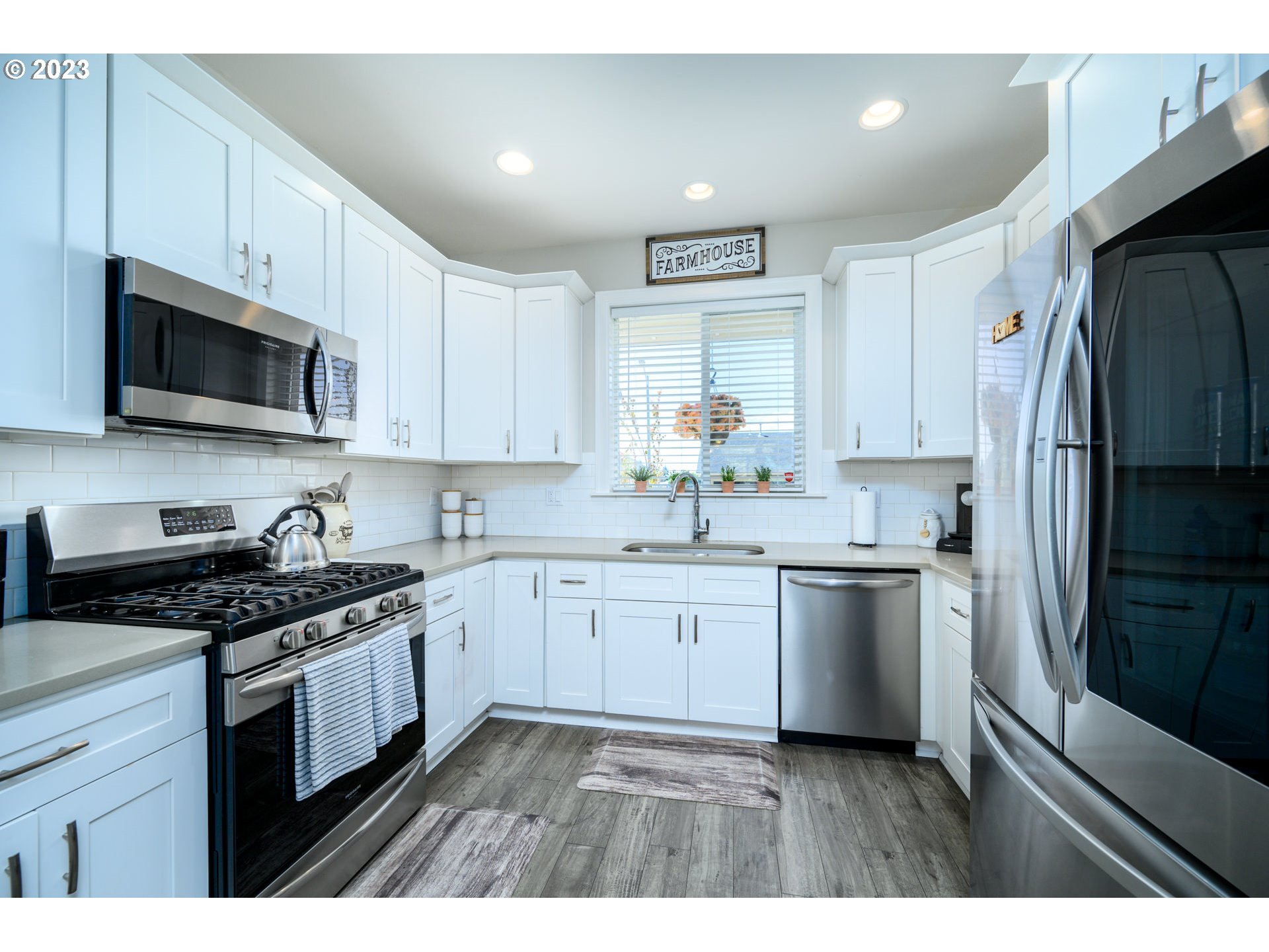 501 Merlot Street Amity, OR 97101 - Photo 13 of 44 a kitchen with a sink stove and refrigerator