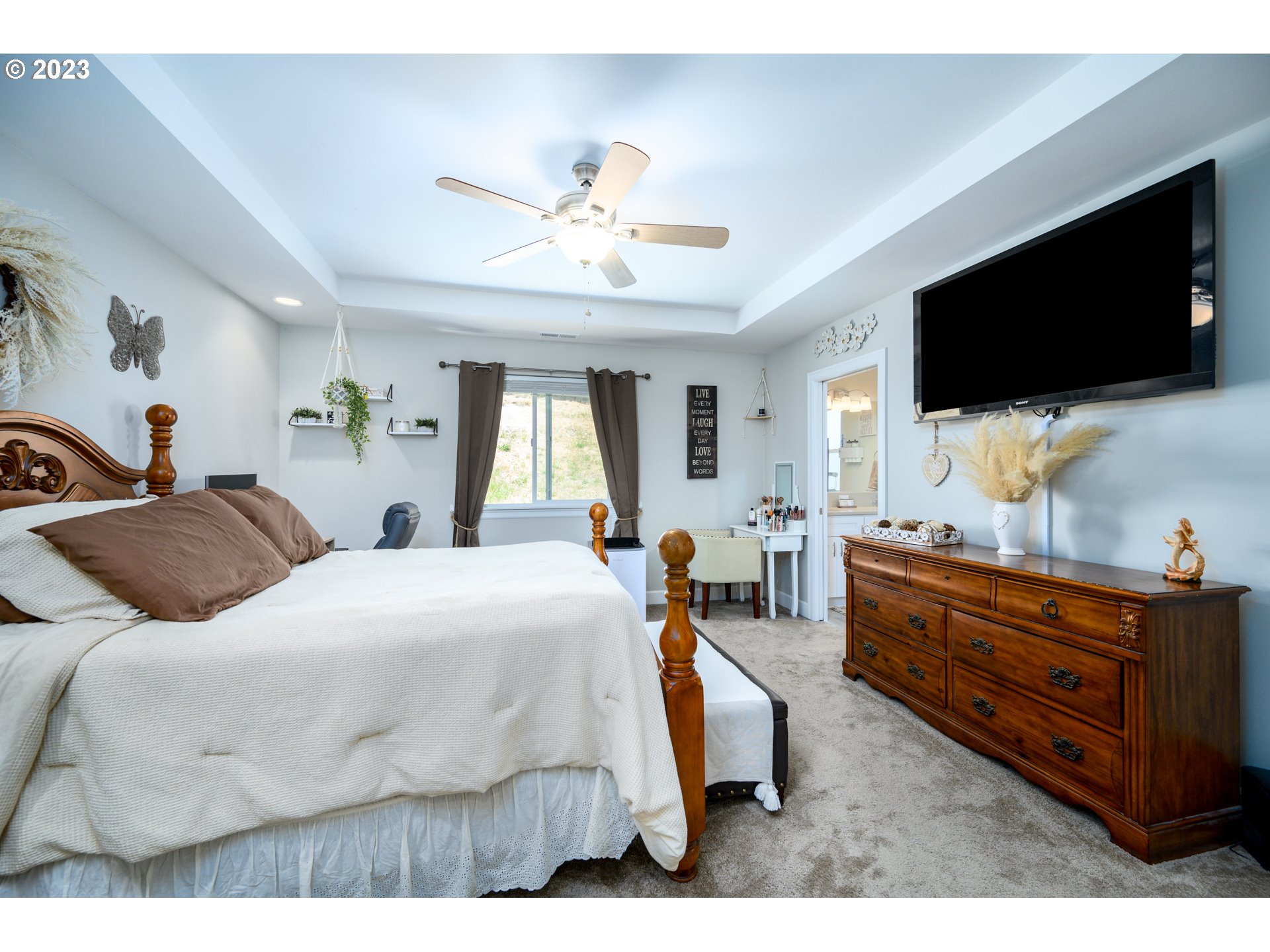 501 Merlot Street Amity, OR 97101 - Photo 18 of 44 a spacious bedroom with a bed and a flat screen tv