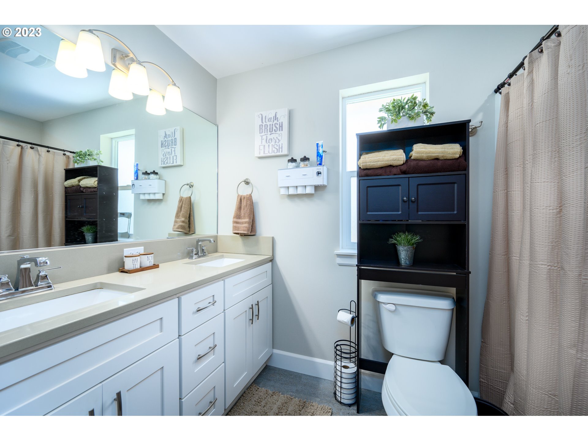 501 Merlot Street Amity, OR 97101 - Photo 20 of 44 a bathroom with a toilet sink and mirror
