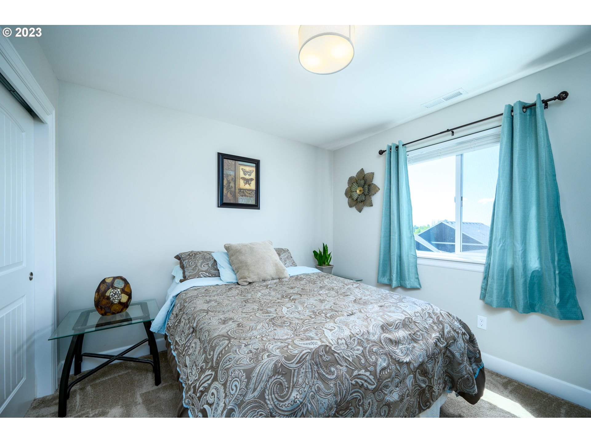 501 Merlot Street Amity, OR 97101 - Photo 24 of 44 a bedroom with a bed and a window