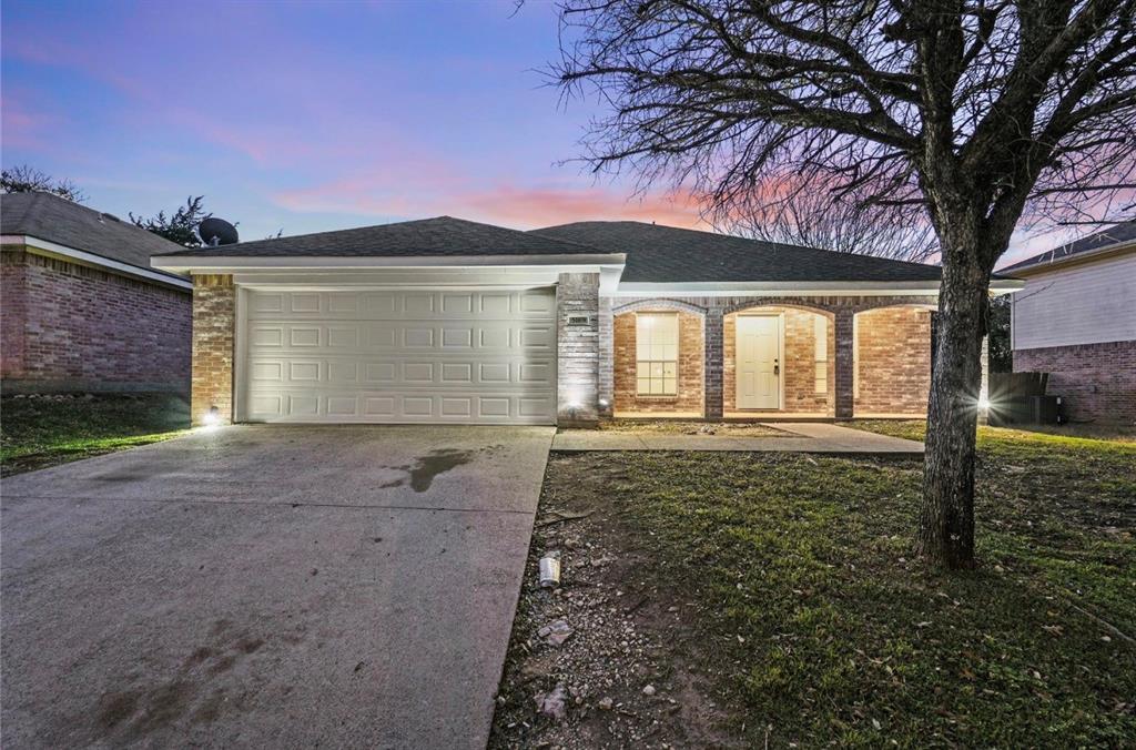 5169 East Rim Road Dallas, TX 75211 - Photo 2 of 19 Brick exterior with an arched entryway