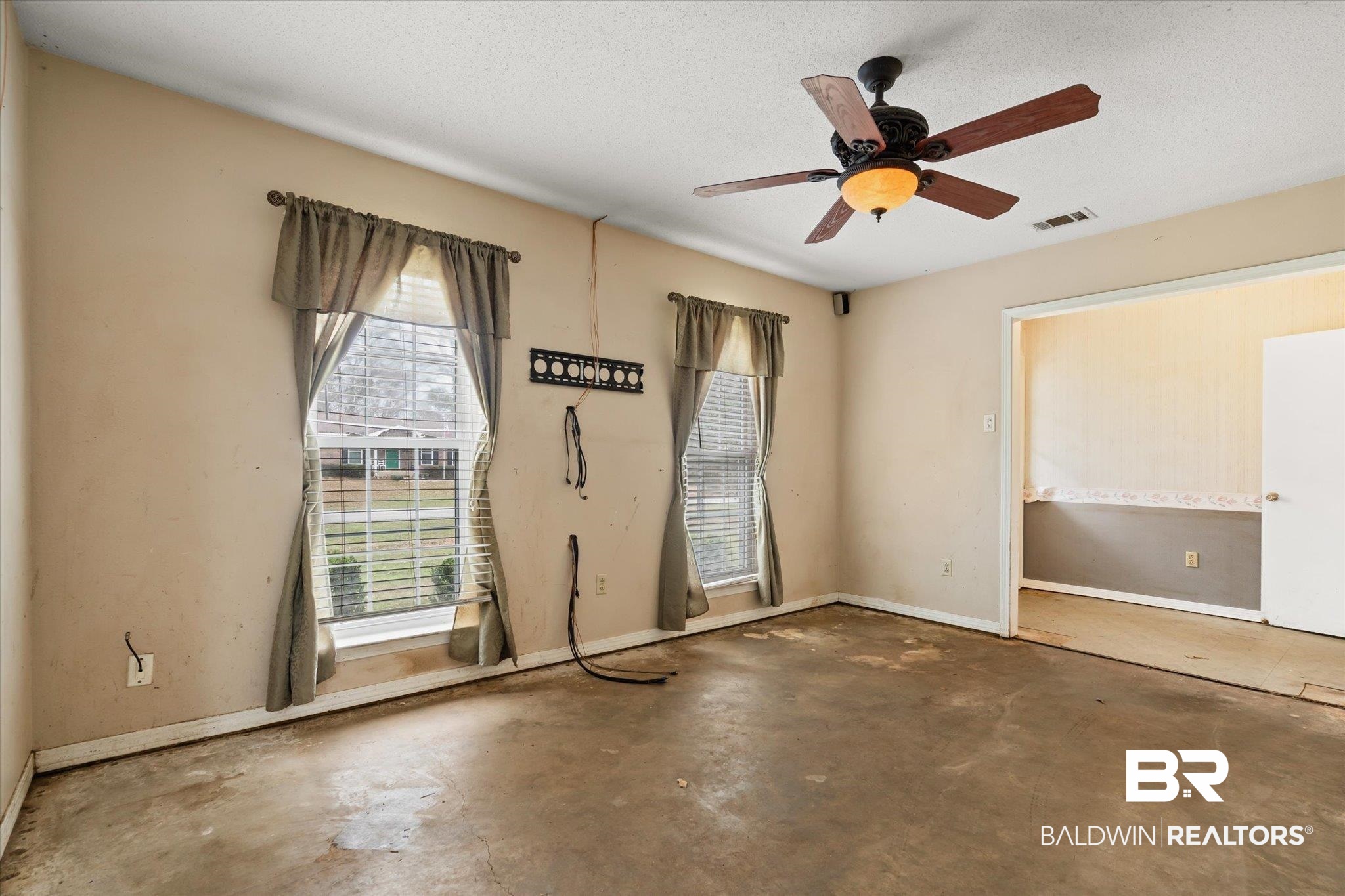 3541 Winston Drive Semmes, AL 36575 - Photo 3 of 20 Unfurnished room featuring concrete floors, visible vents, and plenty of natural light
