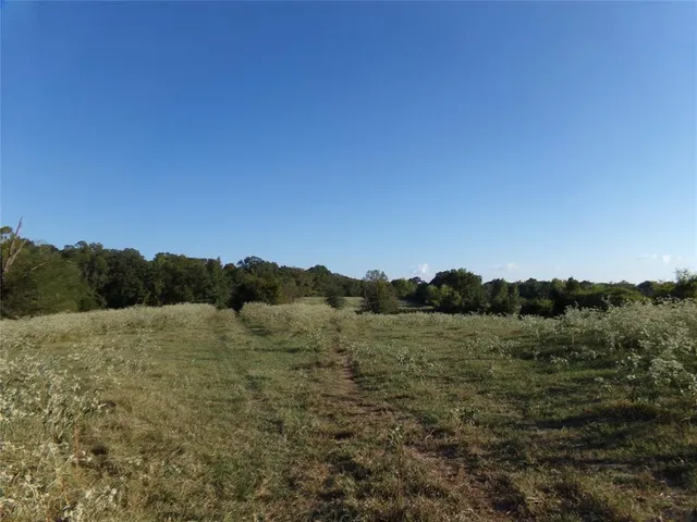 a view of a lake with houses in the back