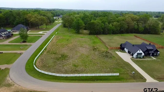 a view of a swimming pool with a yard