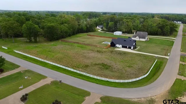a view of a swimming pool with a yard