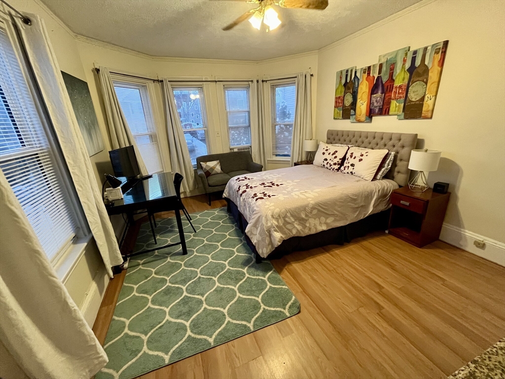 a bedroom with a bed and window