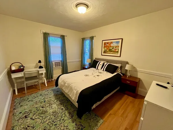 a bedroom with a bed and a table in it