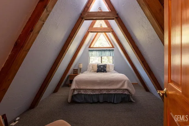 a room with a bed and a window