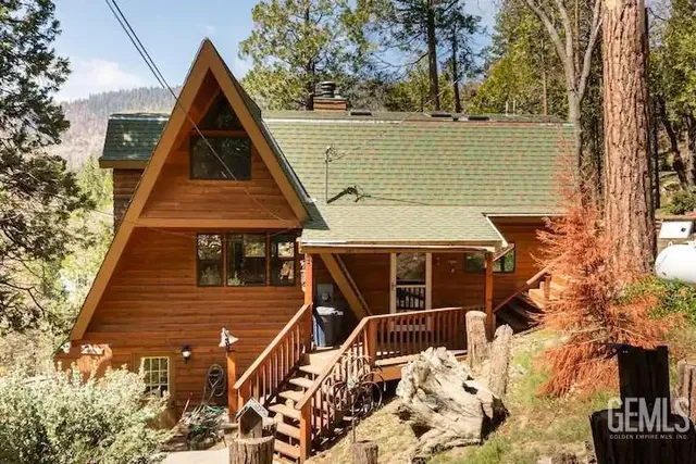 a aerial view of a house with a yard