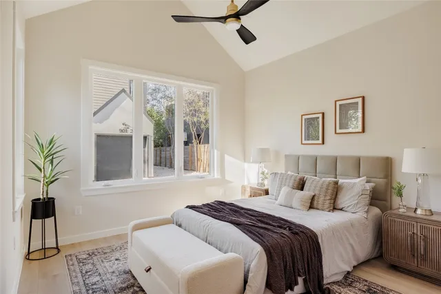 a bedroom with a large bed and a window