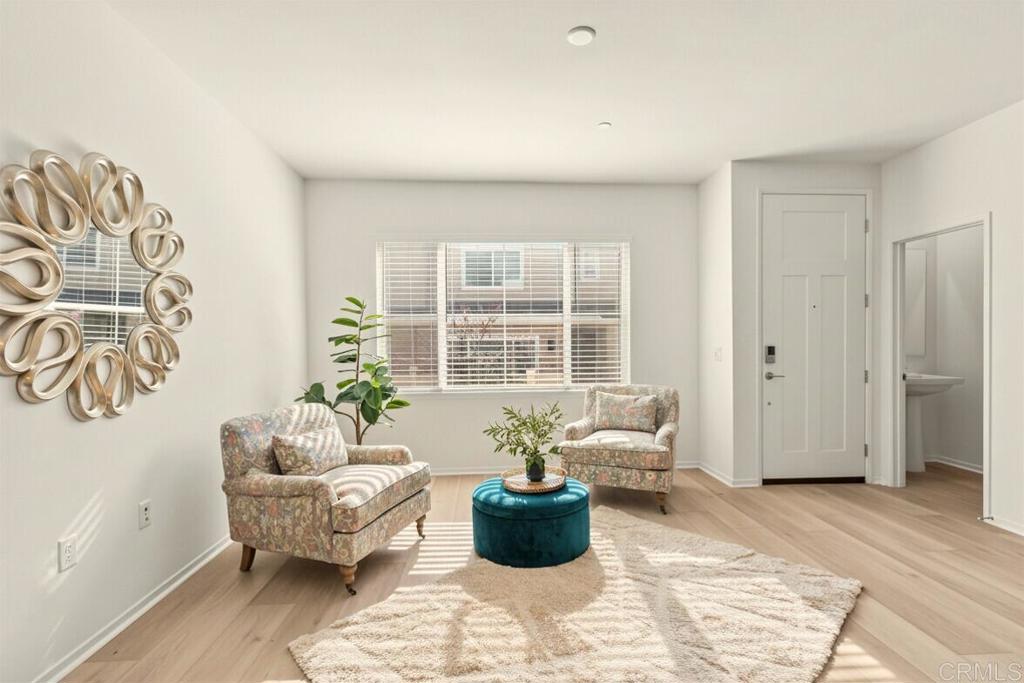 a living room with furniture and windows