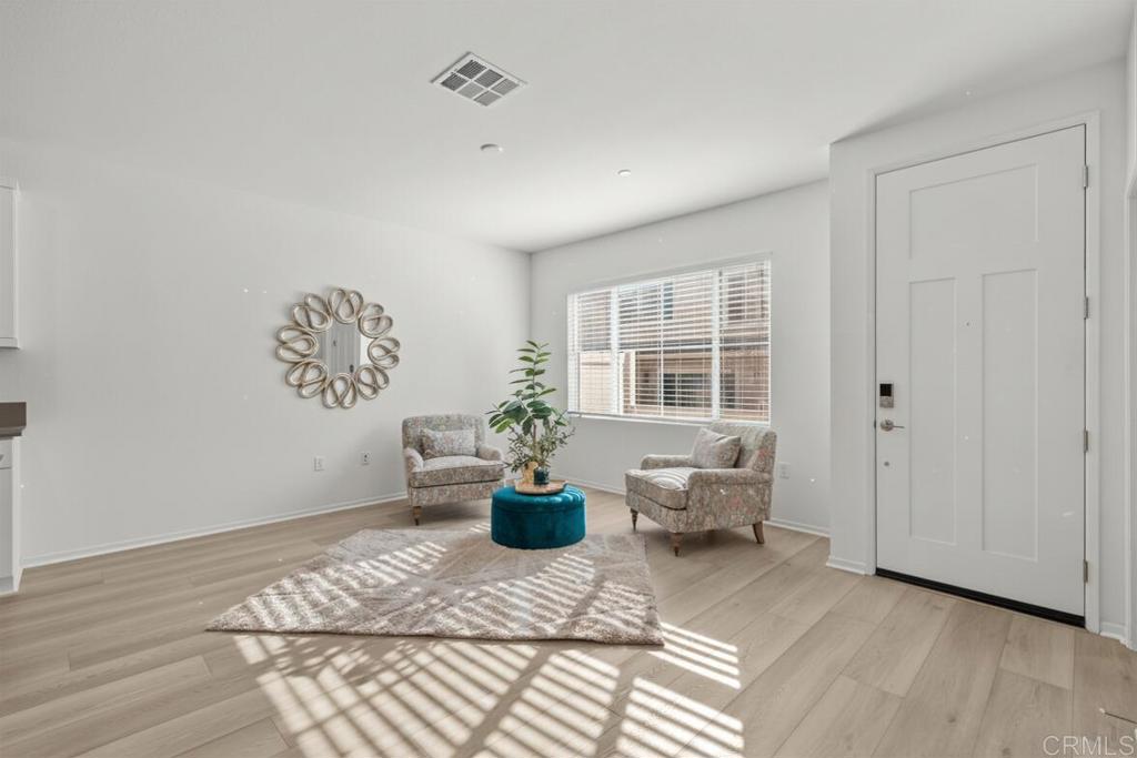 355 Citrine Trail Fallbrook, CA 92028 - Photo 3 of 27 a living room with furniture a window and potted plant