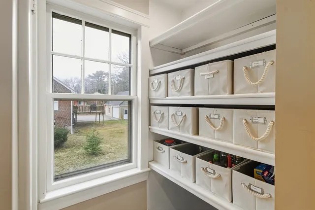 a view of an entryway and wooden floor