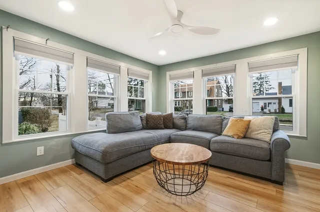 a living room with furniture and a large window