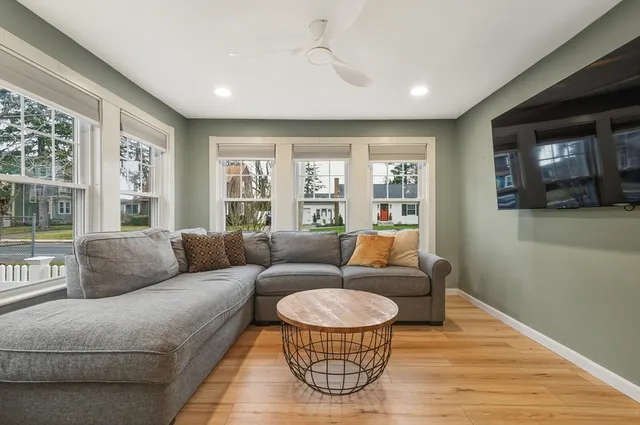 a living room with furniture and a large window