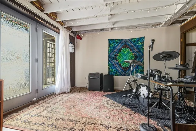 a bedroom with furniture and a window