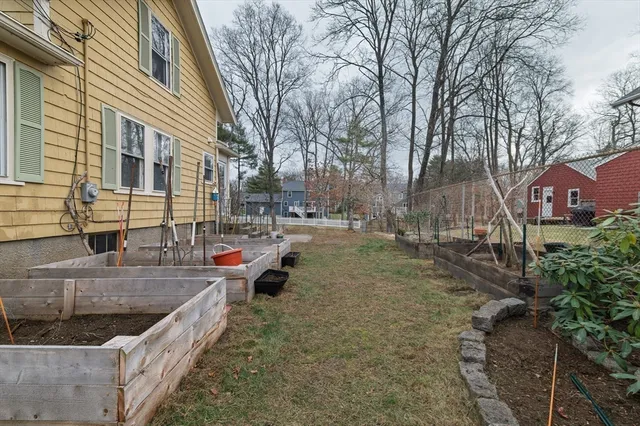 a view of a house with a sink and wooden fence