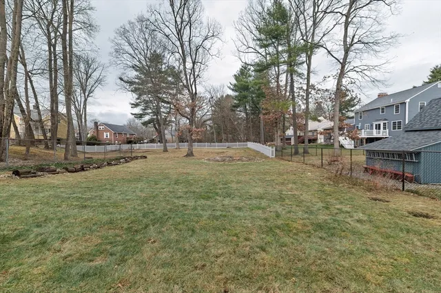 a view of outdoor space with garden and trees