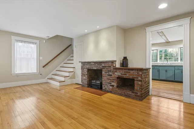 a view of kitchen with furniture fireplace and window
