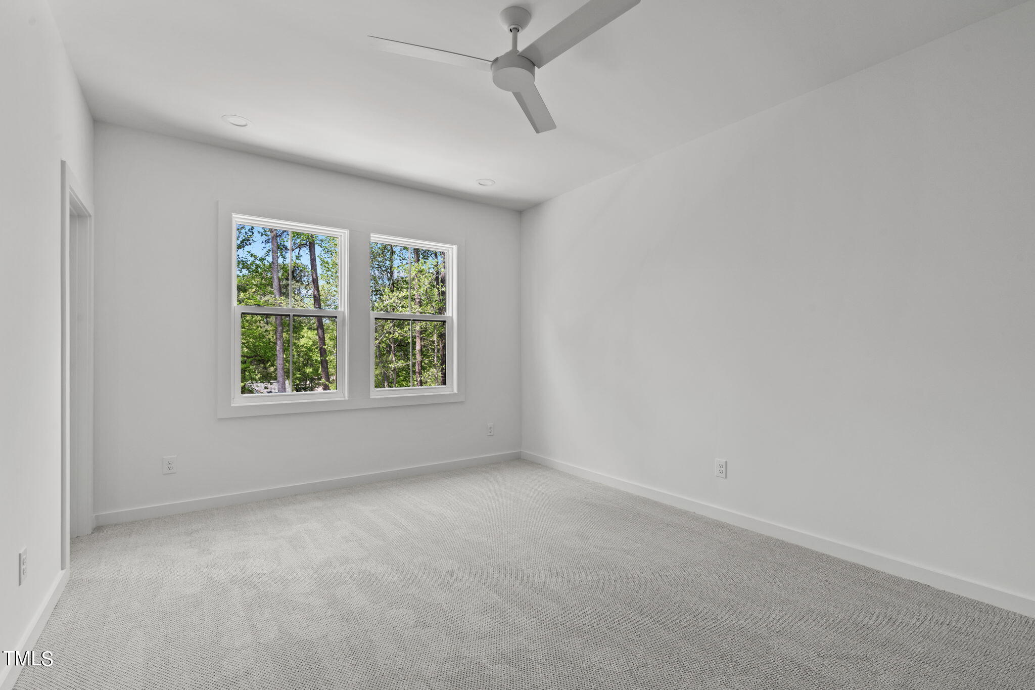 6415 Tanner Oak Lane Raleigh, NC 27613 - Photo 18 of 56 an empty room with windows