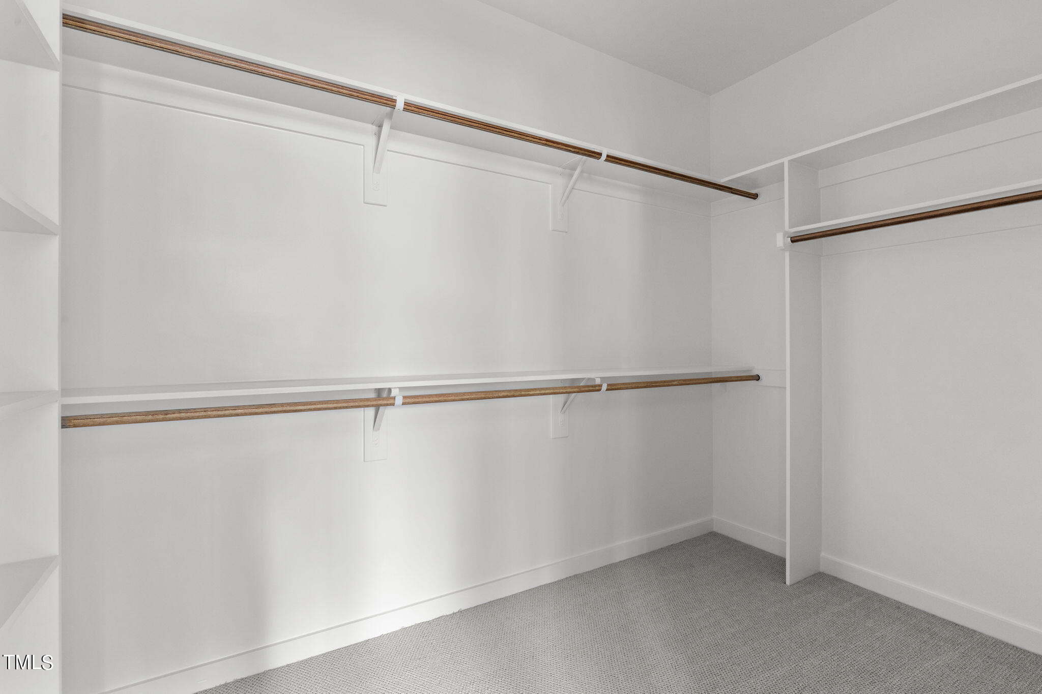 6415 Tanner Oak Lane Raleigh, NC 27613 - Photo 28 of 56 a view of a room with racks on the wall