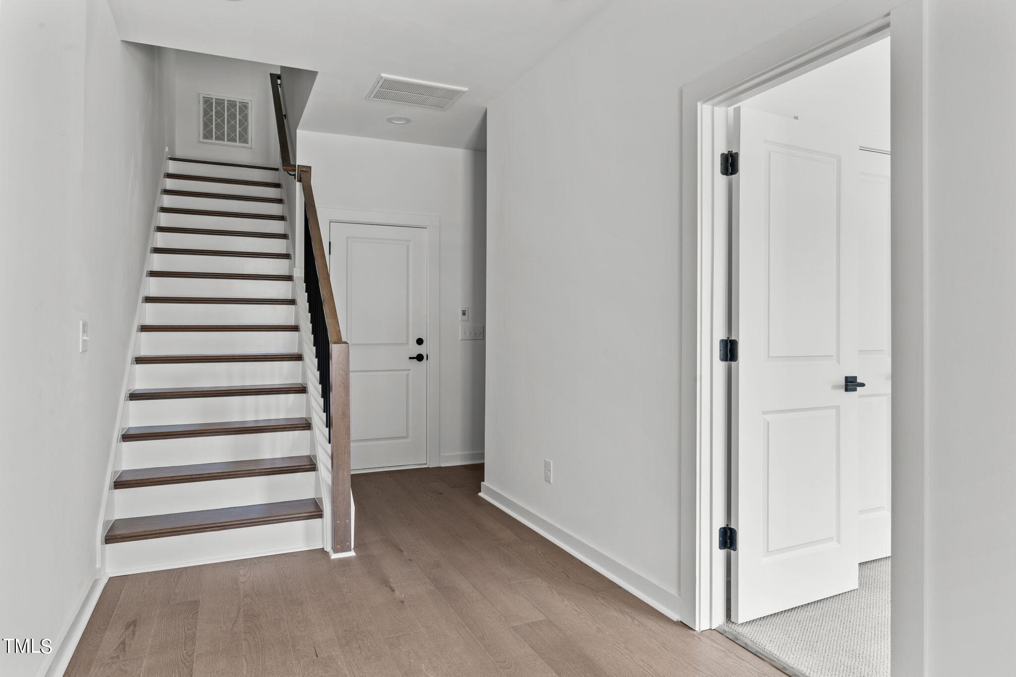 6415 Tanner Oak Lane Raleigh, NC 27613 - Photo 30 of 56 a view of walk in closet with empty racks