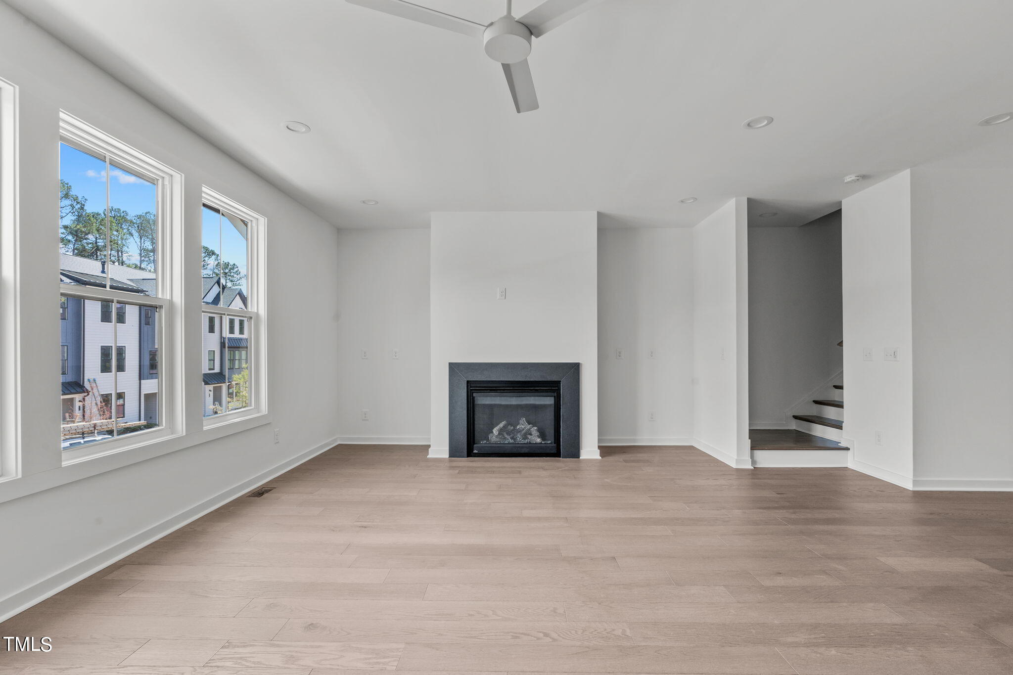 6415 Tanner Oak Lane Raleigh, NC 27613 - Photo 9 of 56 a view of an empty room with a window