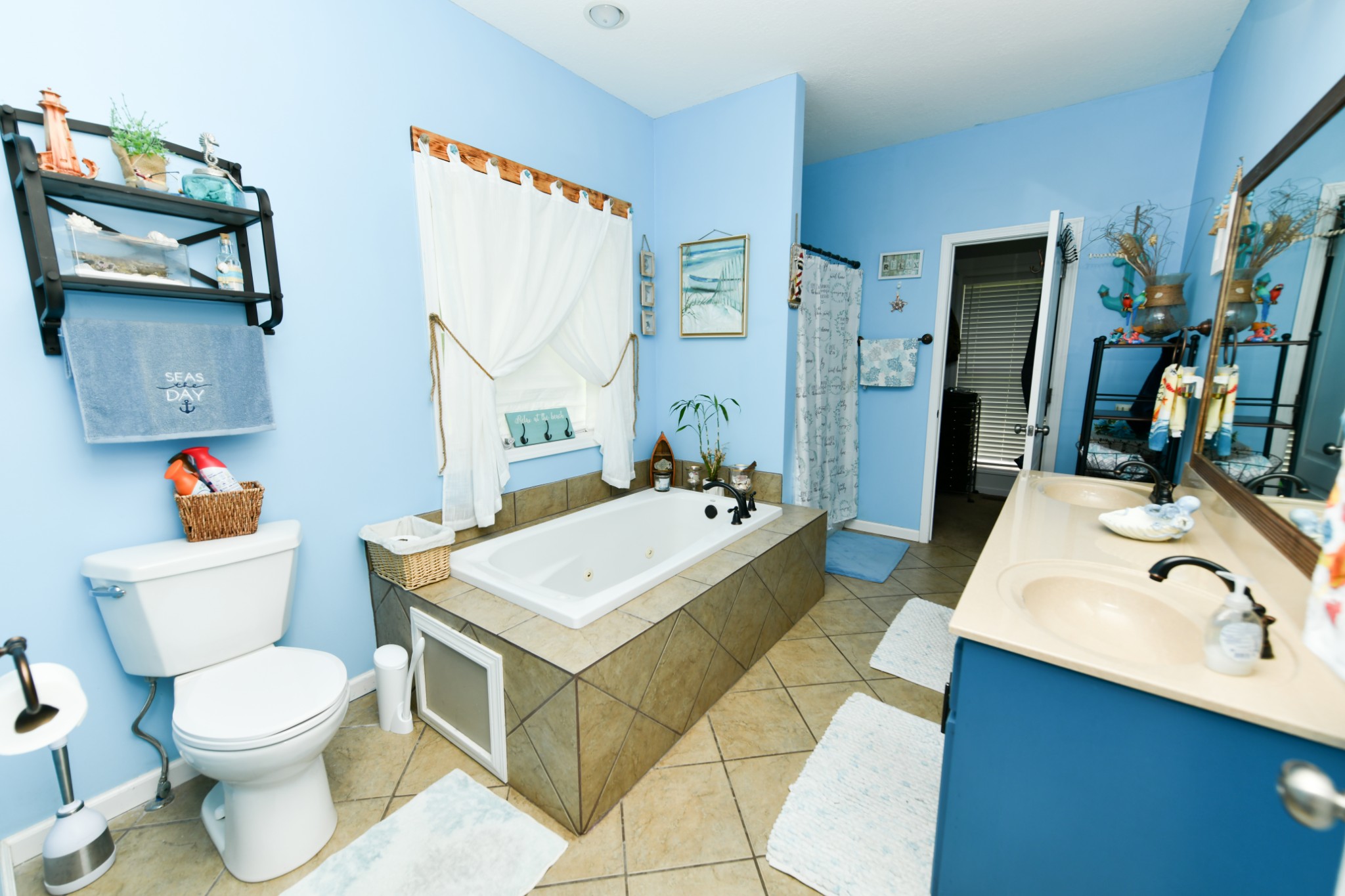 508 Gunson Ridge Road Cumberland City, TN 37050 - Photo 32 of 56 a bathroom with a sink a toilet and a mirror