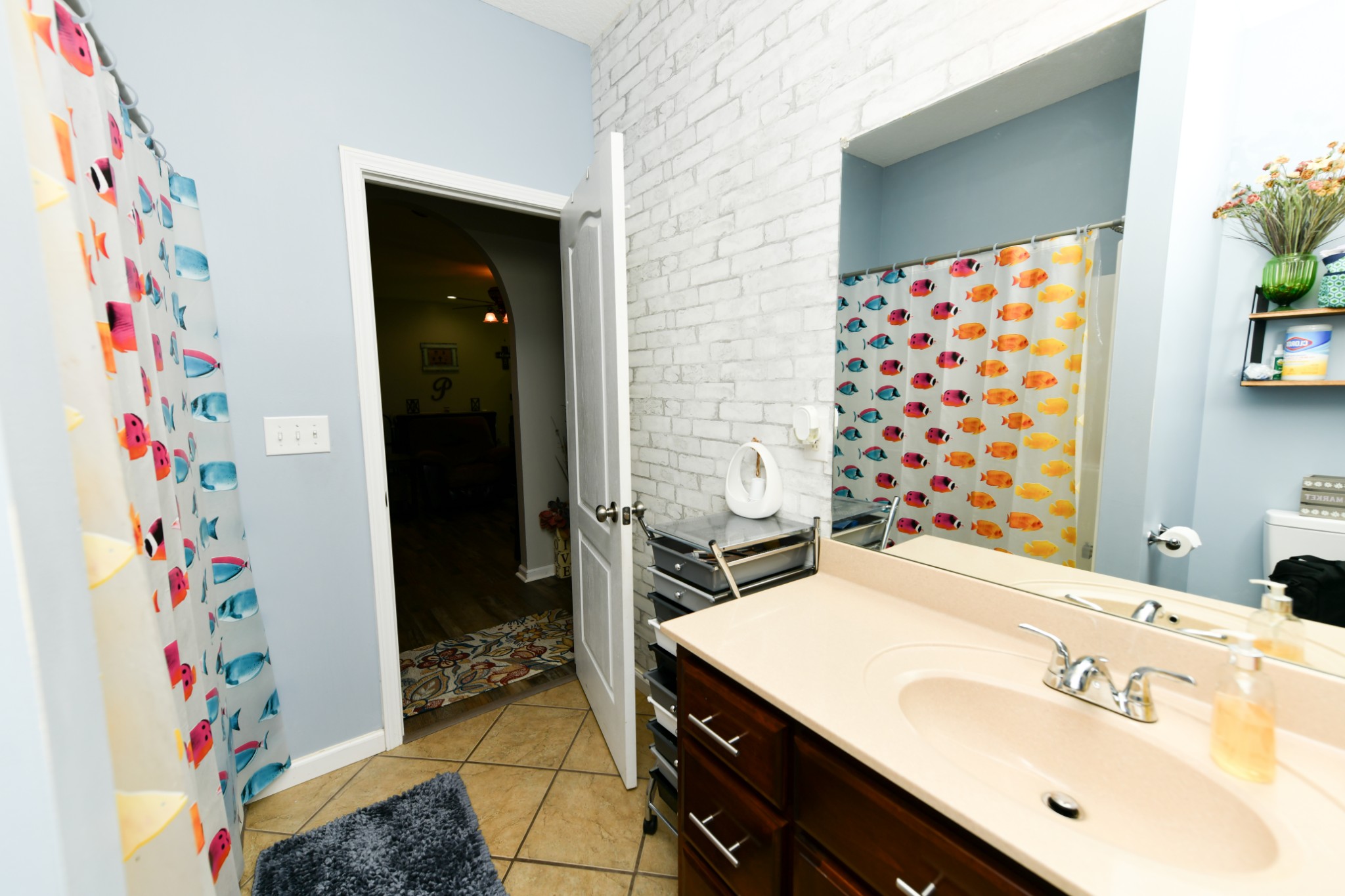 508 Gunson Ridge Road Cumberland City, TN 37050 - Photo 40 of 56 a bathroom with a sink and a shower curtain