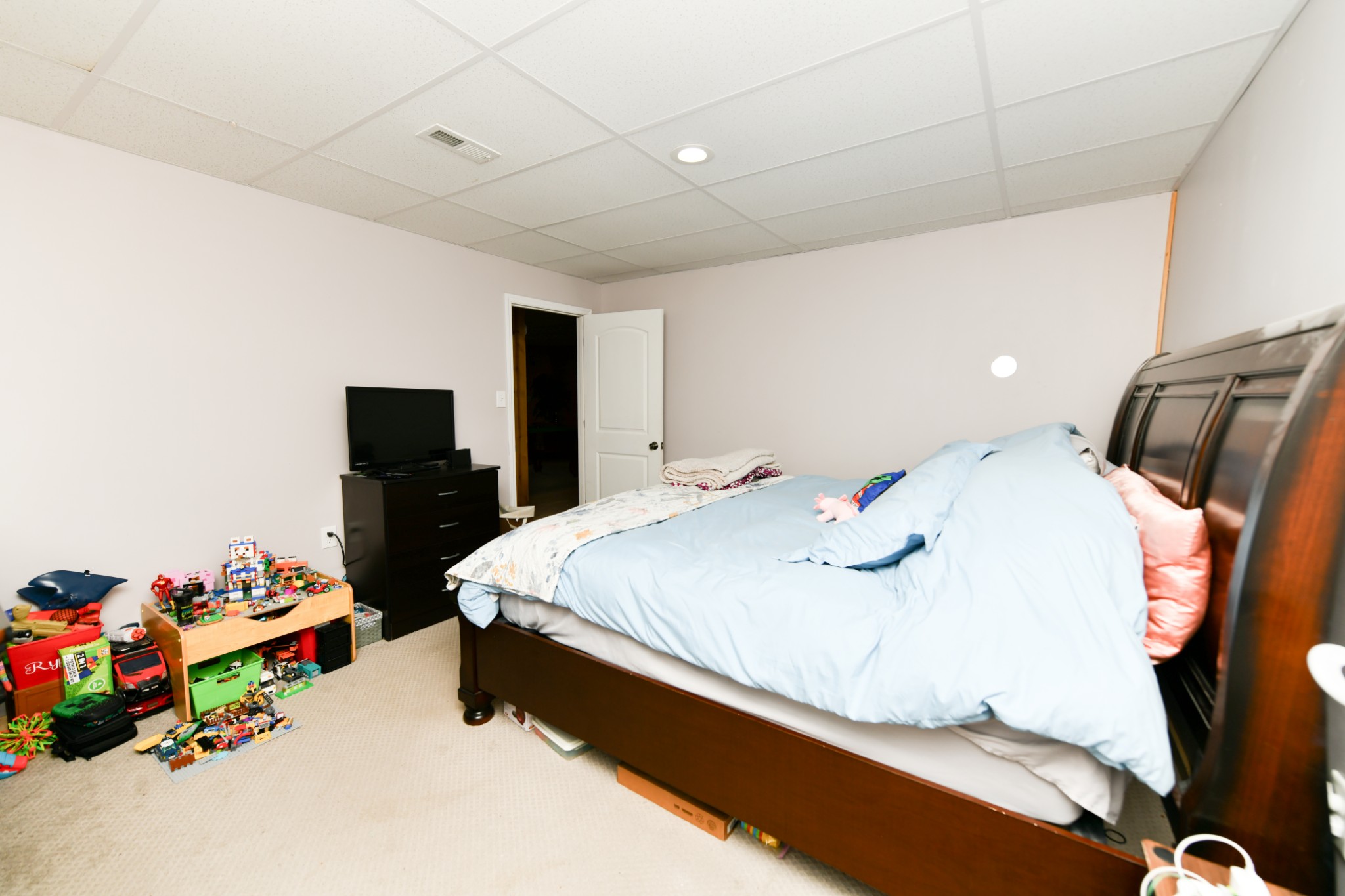 508 Gunson Ridge Road Cumberland City, TN 37050 - Photo 52 of 56 a spacious bedroom with a bed and a tv