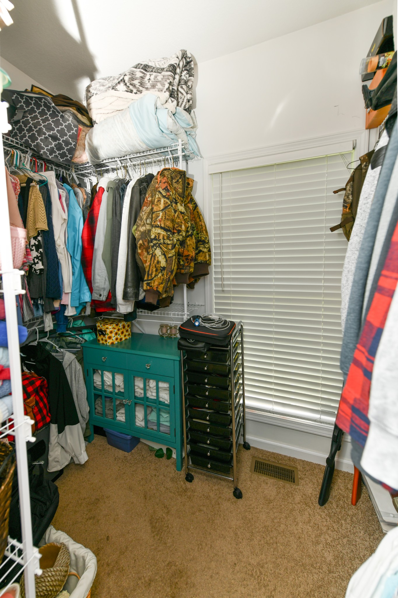 508 Gunson Ridge Road Cumberland City, TN 37050 - Photo 53 of 56 a view of walk in closet with clothes