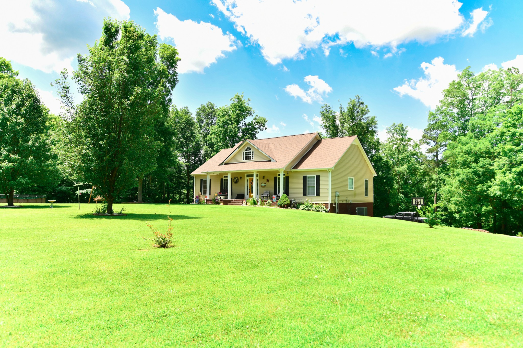 508 Gunson Ridge Road Cumberland City, TN 37050 - Photo 6 of 56 a front view of a house with a yard and trees